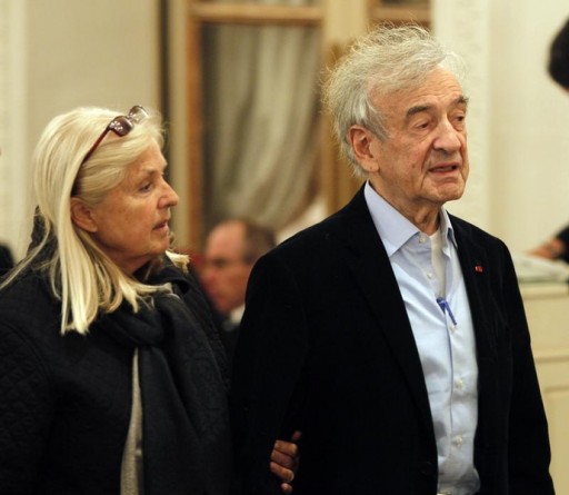 FILE - Holocaust survivor Elie Wiesel (R) arrives with his wife, Marion Erster Rose (L) at Hotel Bristol in Paris, December 14, 2009. REUTERS/ Charles Platiau