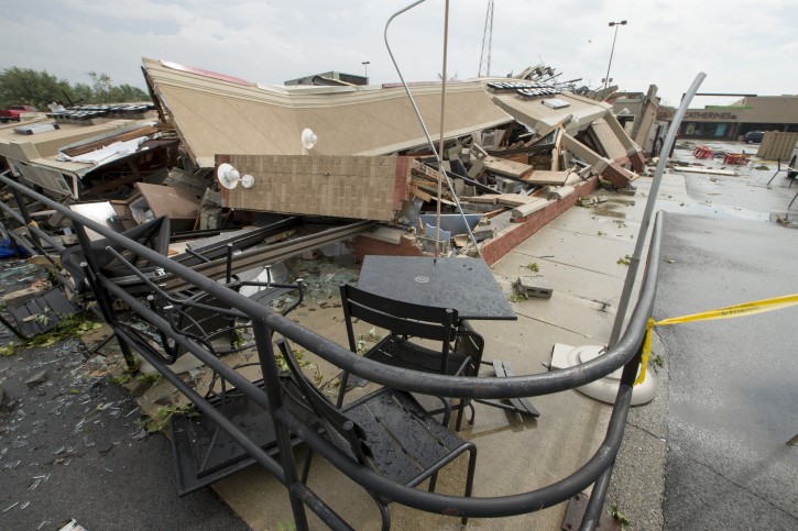 A Starbucks is demolished after an apparent tornado touched down in Kokomo, Ind., Wednesday, Aug. 24, 2016. At least two tornadoes struck cities in central Indiana on Wednesday, tearing the roof off apartment buildings, sending air conditioners falling onto parked cars and cutting power to thousands of people. (Robert Scheer/The Indianapolis Star via AP)