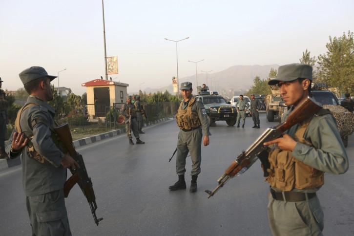 Afghan security forces inspect after a complex attack on the American University of Afghanistan in Kabul, Afghanistan, Thursday, Aug. 25, 2016. The attack has ended, a senior police officer said Thursday, after several people were killed. Kabul police Chief Abdul Rahman Rahimi said the dead included one guard, and that about 700 students had been rescued. (AP Photo/Rahmat Gul)