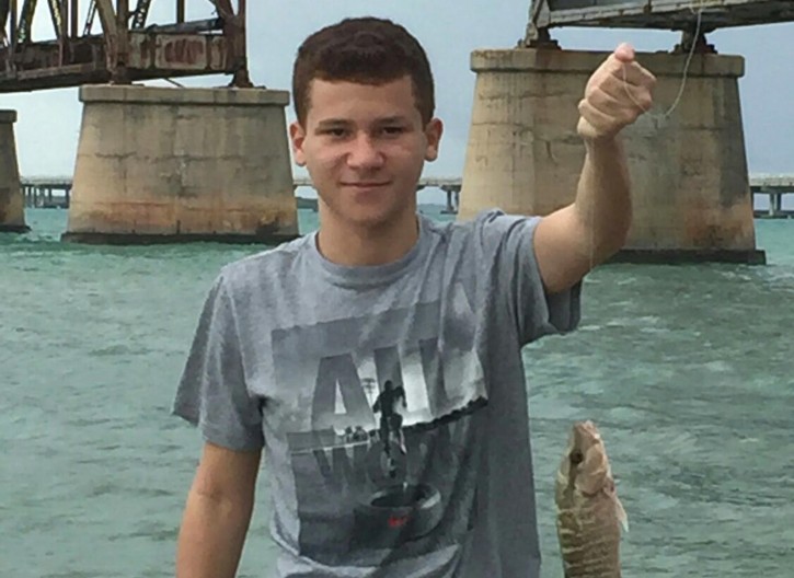 This undated photo released by Florida Hospital Orlando, shows Sebastian DeLeon on a fishing outing. Deleon has survived a brain-eating amoeba that kills most people who contract it, after he was treated at Florida Hospital in Orlando, Fla. Officials say the infection has a fatality rate of 97 percent, and it's often contracted through the nose when swimming in freshwater. (DeLeon Family/Florida Hospital Orlando via AP)