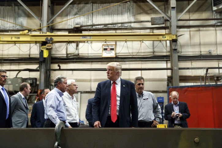 Republican presidential candidate Donald Trump takes a tour of McLanahan Corporation headquarters, a company that manufactures mineral and agricultural equipment, Friday, Aug. 12, 2016, in Hollidaysburg, Pa. (AP Photo/Evan Vucci)