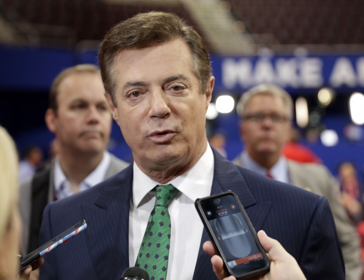 FILE - In this July 17, 2016 file photo, Trump Campaign Chairman Paul Manafort talks to reporters on the floor of the Republican National Convention at Quicken Loans Arena, Sunday, in Cleveland. Republican Donald Trump announced a shakeup of his campaign leadership Wednesday, the latest sign of tumult in his bid for the White House as his poll numbers slip and only 82 days remain before the election. (AP Photo/Matt Rourke)