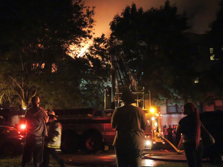 Chicago firefighters battle an apartment fire in the 8100 block of South Essex Avenue in the South Chicago neighborhood early on Tuesday, Aug. 23, 2016. The fire at a Chicago apartment building that appears to have been deliberately set killed multiple people Tuesday, police said. (Alexandra Chachkevitch/Chicago Tribune via AP)