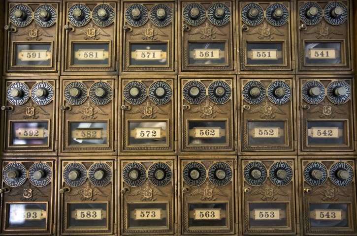 Historic post office boxes are seen Thursday, Aug. 4, 2016, at the oldest continuously operating post office in the U.S., the Hinsdale Post Office in Hinsdale, New Hampshire.The post office is celebrating its 200th birthday. (AP Photo/Jim Cole)