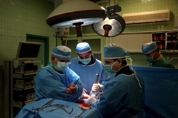 In this July 2, 2016 photo, doctors remove a kidney from a patient at Modarres Hospital in Tehran, Iran. In Iran, a unique system allows those in need of a transplant to buy a kidney. The program, which has seen Iranâs waitlist for kidneys effectively drop to zero, has been championed by some Western doctors as a way to cut time for lifesaving transplants. However, some ethicists worry about the system taking advantage of the poor worldwide to black-market organ sales. (AP Photo/Ebrahim Noroozi)
