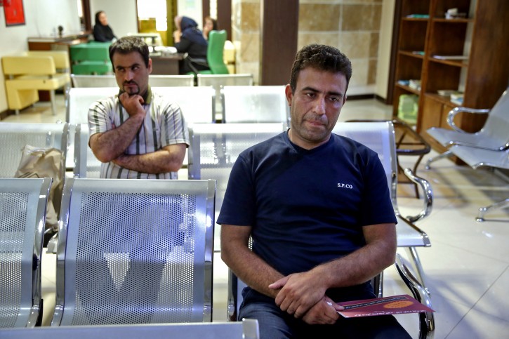 In this picture taken on Monday, June 6, 2016, Iranian Sajjad Ghanbari, a Kidney Seller, waits for his medical exams in a process of selling his kidney in a clinic in downtown Tehran, Iran. (AP Photo/Ebrahim Noroozi)