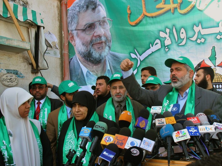 FILE -- In this Jan. 3, 2006 file photo, Hamas top candidate Ismail Hanieh, rights, talks during a press conference surrounded by other candidates at an election rally in Gaza City. Palestinian rivals Hamas and Fatah are gearing up for their first contest at the polls since 2006 -- a vote for 425 mayors and local councils in the West Bank and Gaza Strip on Sept. 8, 2016. Each side hopes the election will give it a foothold in what has been the other's exclusive territory since mutual purges in 2007.  The ballot might not allow either side to proclaim victory, but will provide at least an indication of the popularity of Hamas and Fatah. (AP Photo/Adel Hana, File)