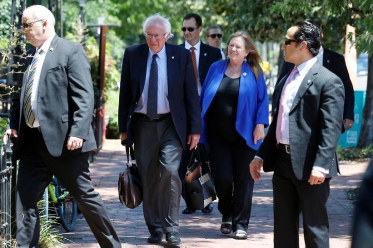 FILE - Democratic U.S. presidential candidate Bernie Sanders walks with his wife Jane Sanders to his campaign headquarters on Capitol Hill in Washington, U.S. June 20, 2016.  REUTERS/Jonathan Ernst