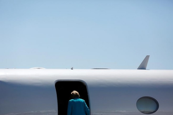 Democratic presidential nominee Hillary Clinton boards her plane at Reno Tahoe International Airport in Reno, Nevada, August 25, 2016.  REUTERS/Aaron P. Bernstein 