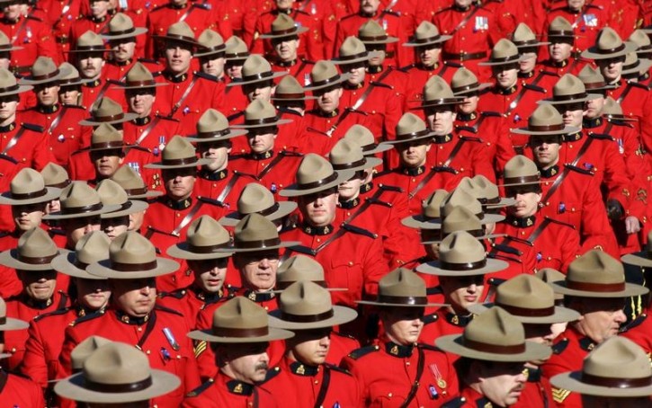 Royal Canadian Mounted Police officers march during a memorial for four slain officers in Edmonton, Alberta, in this March 10, 2005 file photo. Reuters