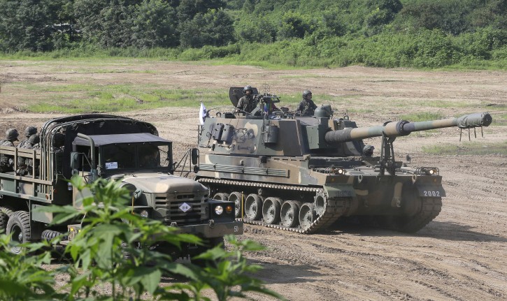 A South Korean army K-9 self-propelled artillery vehicle moves during an exercise in Paju, South Korea, near the border with North Korea, Thursday, Aug. 4, 2016. A medium-range ballistic missile fired Wednesday by North Korea flew about 1,000 kilometers (620 miles) and landed near Japan's territorial waters, Seoul and Tokyo officials said, one of the longest flights by a North Korean missile. (AP Photo/Ahn Young-joon)