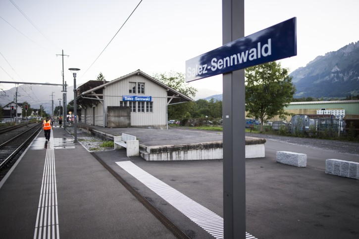 The train station is deserted at Salez - Sennwald following an attack aboard a train when a man attacked other passengers aboard the train at Salez, Switzerland, on Saturday, Aug. 13, 2016. Police in Switzerland say a Swiss man set a fire and stabbed people on a train in the country's northeast, wounding six people some seriously, and injuring himself. (Gian Ehrenzeller / Keystone via AP)