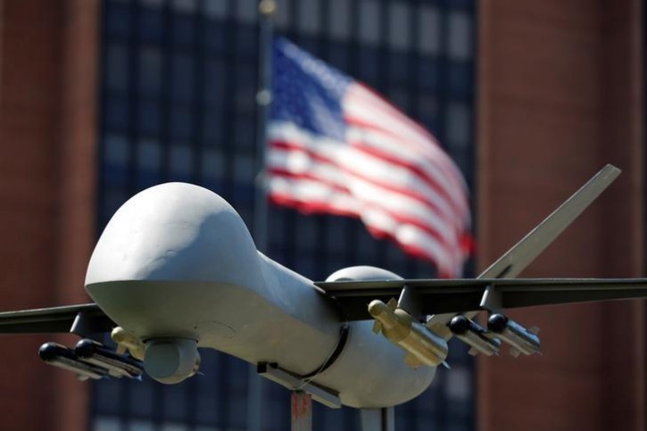 FILE - A model of a military drone is seen in front of an U.S. flag as protesters rally against climate change, ahead of the Democratic National Convention, in Philadelphia, Pennsylvania, U.S., July 24, 2016. REUTERS/Dominick Reuter