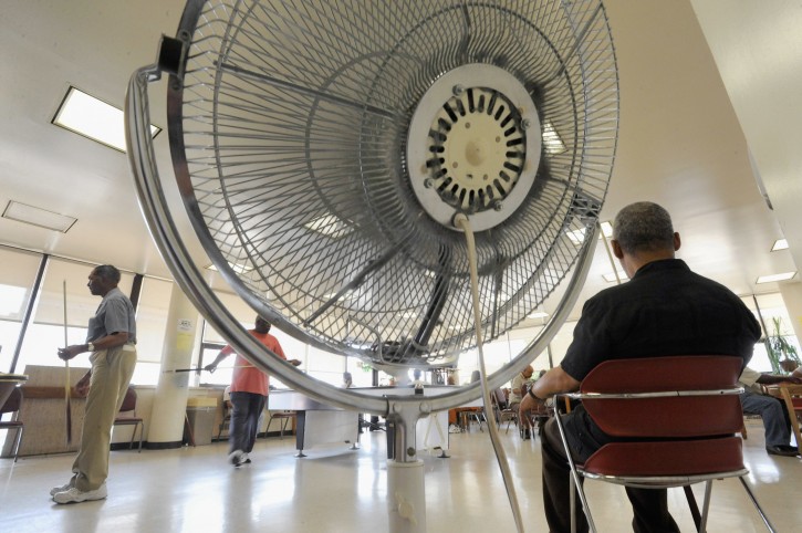 Seniors spend time near a fan at Waxter Senior Center Thursday, June 9, 2011 in Baltimore. The center was designated as a cooling station by Baltimore officials. It could take days for areas broiling under temperatures in the 90s to get relief, forecasters said, as a record-breaking heat wave affects half the country.  (AP Photo/Steve Ruark)