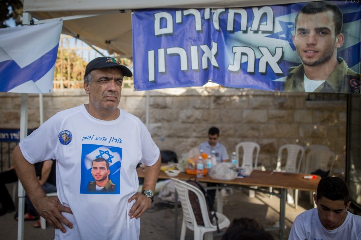 FILE - Herzl Shaul, father of late Israeli soldier Oron Shaul stands at the protest tent outside the Prime Minister Benjamin Netanyahu's residence in Jerusalem on June 26, 2016, as he demands the return of his son body from Hamas captivity. Givati Brigade soldier Staff Sergeant Oron Shaul died in battle in the Gaza Strip during operation protective edge in the summer of 2014, the IDF defined him as "a soldier killed in action whose burial site is unknown." Photo by Yonatan Sindel/Flash90 