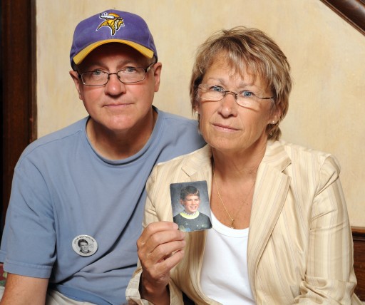 FILE - In this Aug. 28, 2009, file photo, Patty and Jerry Wetterling show a photo of their son Jacob Wetterling, who was abducted in October of 1989 in St. Joseph, Minn and is still missing, in Minneapolis.   Patty Wetterling said Saturday, Sept. 3, 2016 that his remains have been found. Daniel Heinrich, who authorities have called a person of interest in the 1989 kidnapping, denied any involvement and was not charged with that crime. But he has pleaded not guilty to several federal child pornography charges. (AP Photo/Craig Lassig, File)