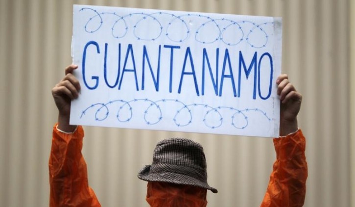 FILE - A supporter of former Guantanamo Bay inmate Australian David Hicks protests outside the Supreme Court in Sydney August 3, 2011. Reuters