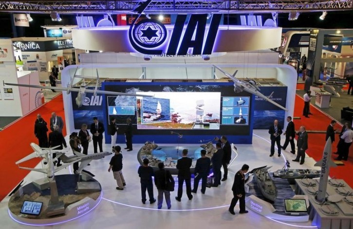FILE - Visitors watch a demonstration at the Israel Aerospace Industries (IAI) booth in the IMDEX Asia maritime defence exhibition in Singapore May 19, 2015. REUTERS/Edgar Su/File Photo 