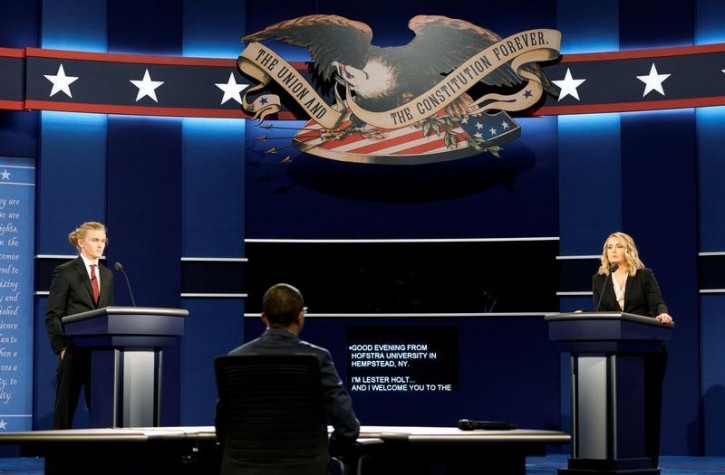 Hostra University students playing the roles of the candidates and moderator go through a rehearsal for the first U.S. presidential debate at Hofstra University in Hempstead, New York September 25, 2016. Left to right are Joseph Burch, Christian Stewart and Caroline Mullen. REUTERS/Rick Wilking
