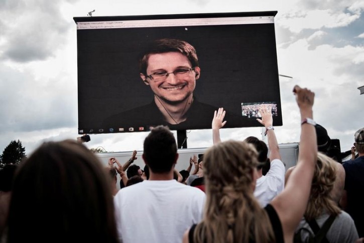 American whistleblower Edward Snowden is seen on a screen as he delivers a speech during the Roskilde Festival in Roskilde, Denmark, June 28 2016. Scanpix Denmark/Mathias Loevgreen Bojesen /via REUTERS