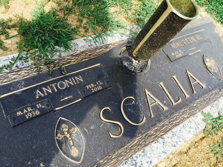 In this photo taken Aug. 14, 2016, the gravesite of Supreme Court Justice Antonin Scalia at Fairfax Memorial Park in Fairfax, Va.   Thousands attended Supreme Court Justice Antonin Scaliaâs funeral in Washington earlier this year, but when the hearse pulled away from the church and headed to his burial site, his family asked for privacy and the Supreme Court declined to say where Scalia was being laid to rest. With the internetâs help, however, Scaliaâs burial spot at Virginiaâs Fairfax Memorial Park is now public.    (AP Photo/Jessica Gresko)