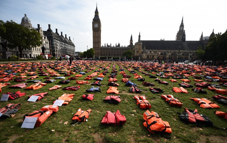 Life jackets worn by fleeing refugees lie in Parliament Square in London, Britain, 19 September. Thousands of life-jackets were laid out in Parliament Square to highlight the need to protect refugees and migrants. The jackets serve as a visual reminder of the suffering and risks hundreds of thousands of refugees have endured. World leaders are meeting at the United Nations Migration summit in New York these days.  EPA/ANDY RAIN