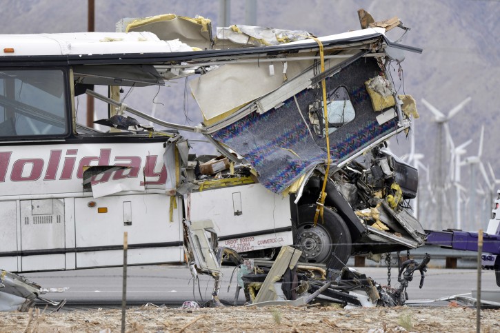 A damaged steering wheel can be seen in the wreckage on the ground in front of a tour bus that crashed with a semi-truck on Interstate 10 just west of the Indian Canyon Drive off-ramp, in Desert Hot Springs, Calif., near Palm Springs, Calif., on Sunday, Oct. 23, 2016. Several deaths and injuries were reported. (AP Photo/Rodrigo PeÃ±a)