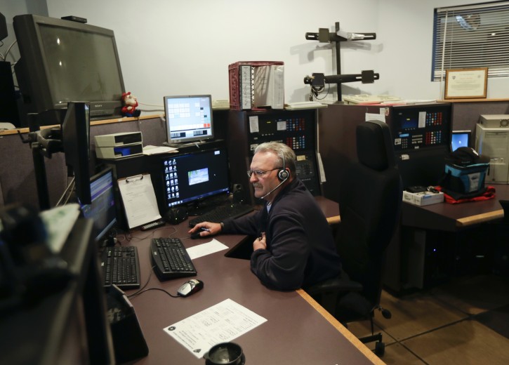 In this Thursday, Oct. 13, 2016 photo, communications officer Steve Schongar works in the 911 dispatch center at the Rensselaer County Public Safety Building in Troy, N.Y. (AP Photo/Mike Groll)