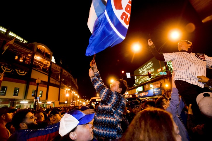 Chicago Cubs fans celebrate outside of Wrigley Field after Game 6 of of the National League baseball championship series against the Los Angeles Dodgers Saturday, Oct. 22, 2016, in Chicago. (AP Photo/Matt Marton)