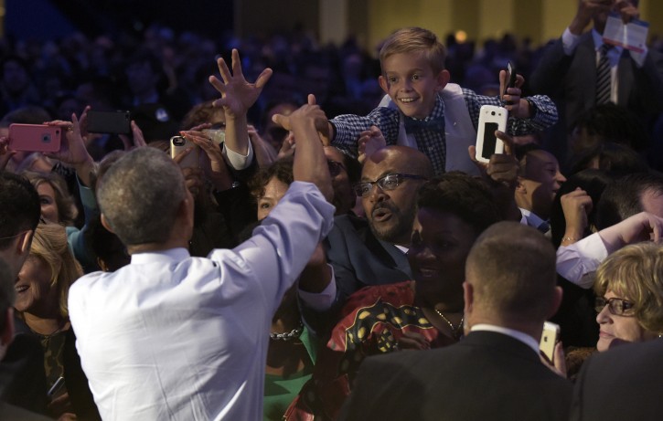 President Barack Obama greets the crowd after speaking at a campaign event for the Ohio Democratic Party at the Greater Columbus Convention Center in Columbus, Ohio, Thursday, Oct. 13, 2016.  (AP Photo/Susan Walsh)