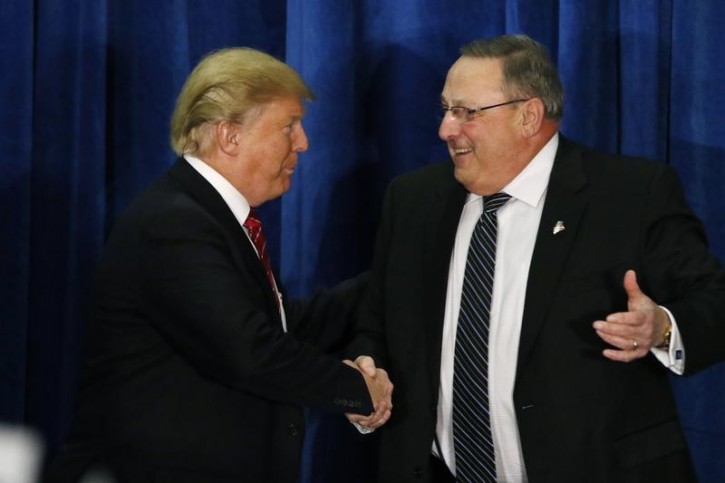 Republican U.S. presidential candidate Donald Trump shakes hands with Maine Governor Paul LePage (R) after LePage introduced him at a campaign rally in Portland, Maine March 3, 2016.  REUTERS/Joel Page 