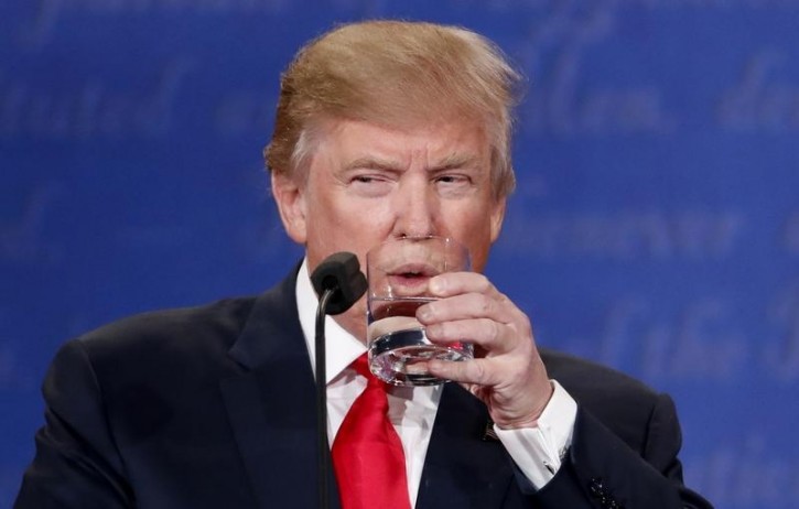 Republican U.S. presidential nominee Donald Trump sips water during the third and final debate with Democratic nominee Hillary Clinton (not pictured) at UNLV in Las Vegas, Nevada, U.S., October 19, 2016.    REUTERS/Rick Wilking