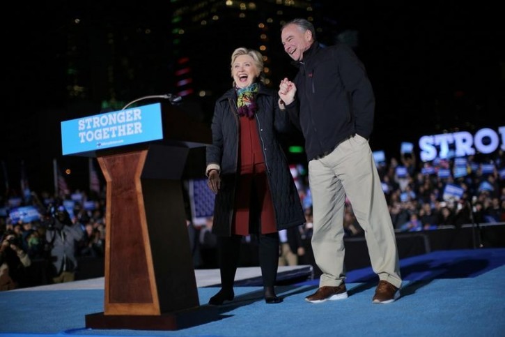 U.S. Democratic presidential nominee Hillary Clinton and vice presidential candidate Tim Kaine attend a campaign rally in downtown Philadelphia, U.S., October 22, 2016. REUTERS/Carlos Barria