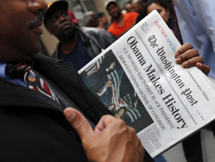FILE - In this Nov. 5, 2008, file photo, people line up outside of the Washington Post newspaper to purchase special election editions in Washington. Newspapers are printing extra copies and setting up temporary retail stands after recalling the frenzy for an ink-stained memento after Barack Obamaâs historic win in 2008. Many people now rely on Facebook and apps for news, but a screenshot doesnât have quite the same romance as a newspaperâs front page. (AP Photo/Haraz N. Ghanbari, File)