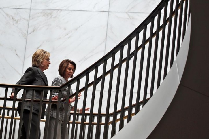 Democratic U.S. presidential candidate Hillary Clinton (L) and U.S. House Minority Leader Nancy Pelosi (D-CA) leave a House Democratic Caucus meeting on Capitol Hill in Washington, U.S., June 22, 2016. REUTERS/Carlos Barria -