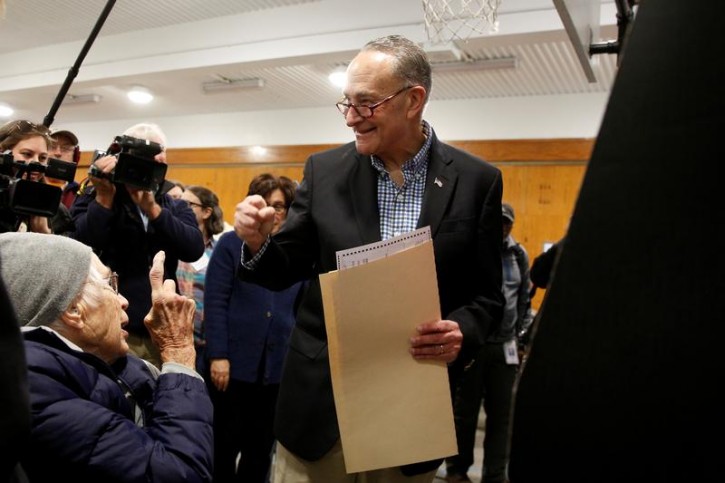 U.S. Senator Chuck Schumer (D-NY) greets supporters while he votes at PS 321 in the Brooklyn borough of New York City, U.S., November 8, 2016.  REUTERS/Brendan McDermid