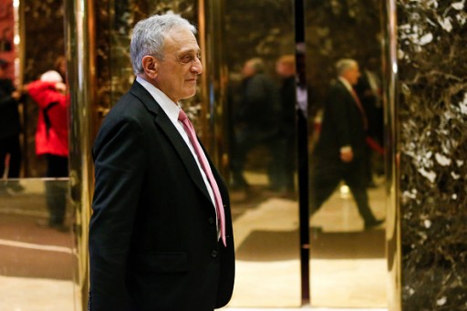 FILE - American businessman Carl Paladino steps off the elevator after meetings with President-elect Donald Trump at Trump Tower on December 5, 2016 in New York. / AFP / KENA BETANCUR  