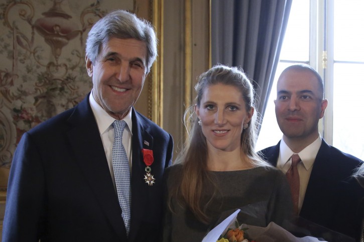 U.S. Secretary of State John Kerry, left, poses with his daughter Vanessa and his son in law, Brain Nahed after being awarded of the Legion d'Honneur medal, at the Quai d'Orsay, in Paris, Saturday, Dec. 10, 2016. The Foreign Ministry said he earned the distinction "for his contribution of the development of relations between France and the United States, and his indefatigable efforts in favor of peace in the world." (AP Photo/Thibault Camus, Pool)