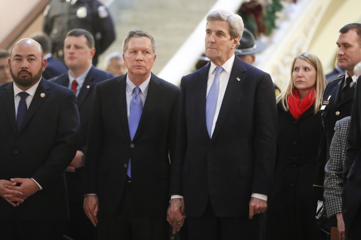 Ohio Governor John Kasich, center left, and U.S. Secretary of State John Kerry, center right, arrive to pay their respects to John Glenn as he lies in honor, Friday, Dec. 16, 2016, in Columbus, Ohio. Glenn's home state and the nation began saying goodbye to the famed astronaut who died last week at the age of 95. (AP Photo/John Minchillo)