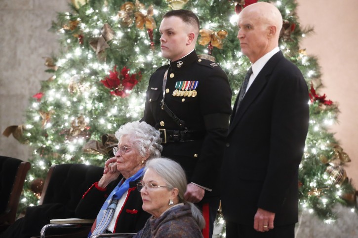 Annie Glenn, left, arrives to view the casket of her husband John Glenn, alongside her daughter Carolyn Ann Glenn, and son David, right, as their father lies in honor, Friday, Dec. 16, 2016, in Columbus, Ohio. Glenn's home state and the nation began saying goodbye to the famed astronaut who died last week at the age of 95. (AP Photo/John Minchillo)