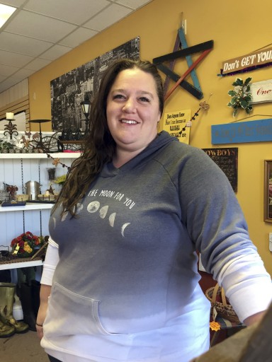 In this Dec. 13, 2016 photo, Shay Chamberlain, 37, posed for a picture in her small clothing store and boutique in Menomonie, Wis. As each Cabinet announcement draws fresh criticism of Donald Trumpâs latest appointees, many Americans who voted for him, like Chamberlain, say the president-elect is doing what he promised to do: draining the swamp. (AP Photo/Amy Forliti)
