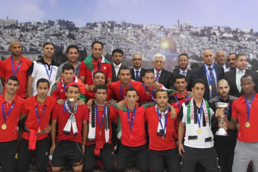 The Palestinian national soccer team along with PA President Mahmoud Abbas after winning the AFC Challenge Cup in May 2014 (Photo Credit: Issam Rimawi/ Flash 90)