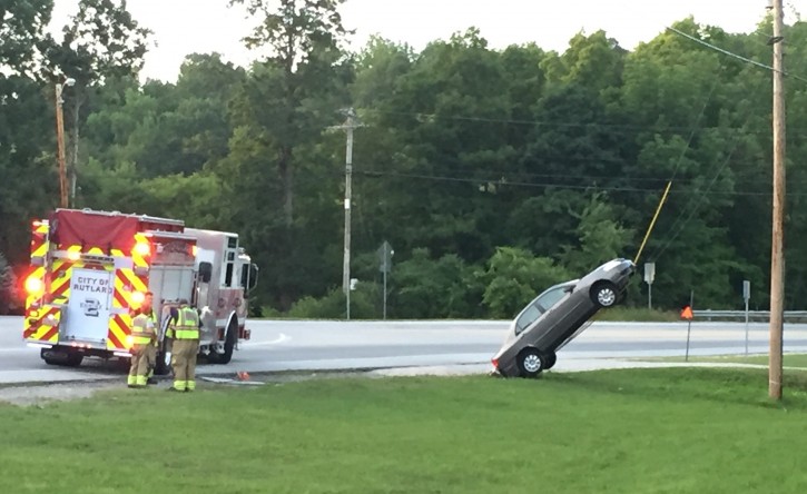 GPS Crash This Wednesday, July 27, 2016, photo provided by G. Ray Ault shows a vehicle on wires attached to a utility pole in Mendon, Vt. Police in Vermont say the car ended up almost vertical when the driver swerved quickly in response to her GPS ordering her to "turn around." (G. Ray Ault via AP)