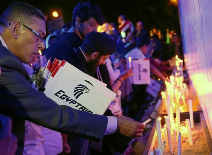 People light candles during a candlelight vigil for the victims of EgyptAir flight 804, at the Cairo Opera House in Cairo FILE - People light candles during a candlelight vigil for the victims of EgyptAir flight 804, at the Cairo Opera House in Cairo, Egypt May 26, 2016. REUTERS/Mohamed Abd El