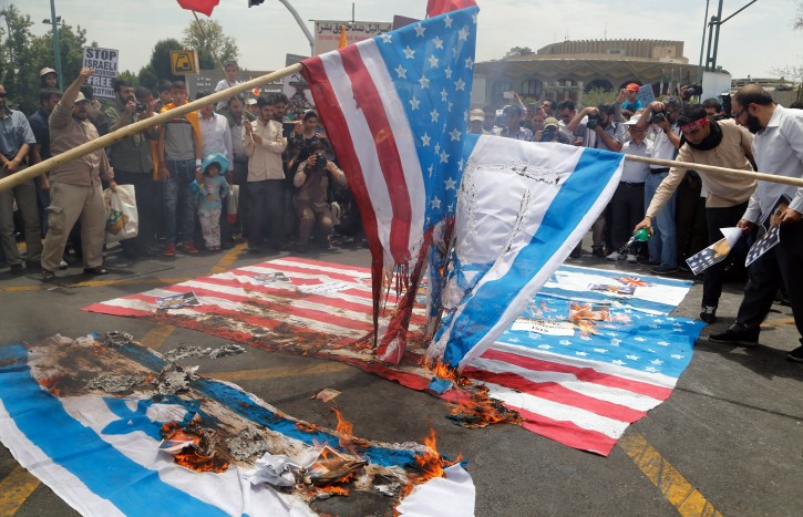 Anti-Israel rally in Tehran ranians burn US and Israeli flags during an anti-Israel rally marking Qods Day (Jerusalem Day), in support of Palestinian resistance against Israeli occupation, in Tehran, Iran, 01 July 2016. Each year Iran marks the last Friday of the fasting month of Ramadan as a solidarity day with the Palestinians. EPA/STRINGER