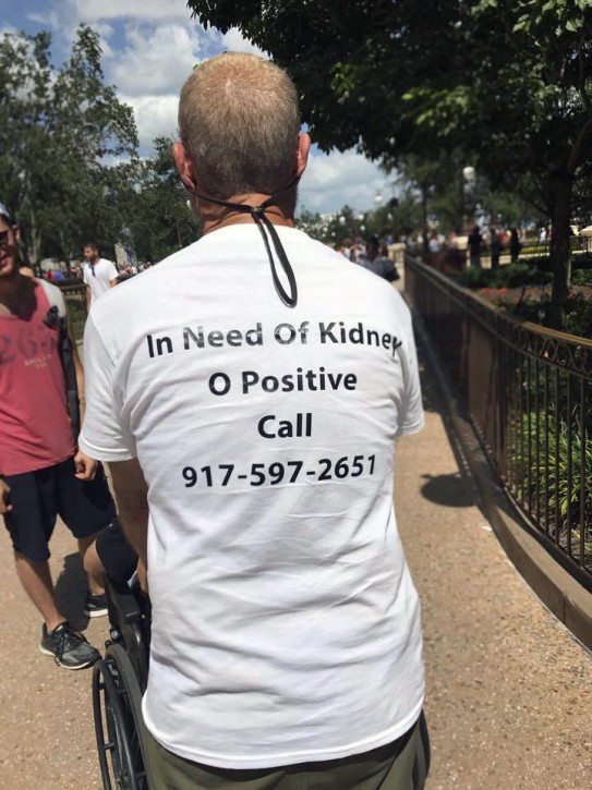 In this Aug. 22, 2017 photo, Robert Leibovitz wears a T-shirt with information about his need for a kidney while visiting Disney World in Orlando, Fla. Leibowitz, a New Jersey father of five whose T-shirt saying “In Need of Kidney” went viral has received a life-saving transplant from a stranger. (Rocio Sandoval via AP)