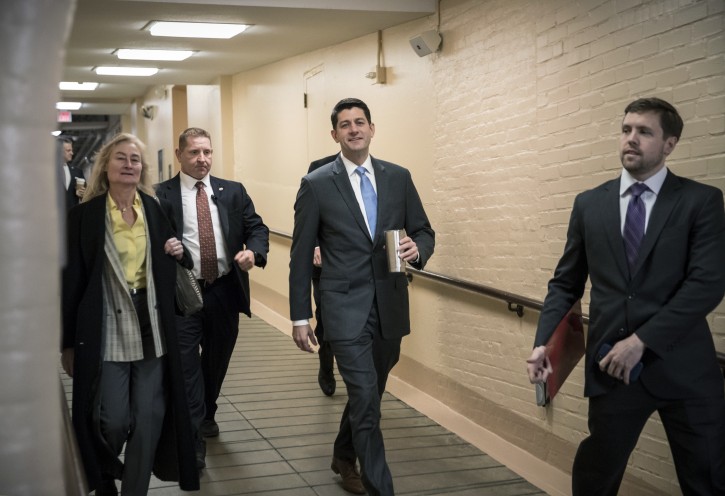 House Speaker Paul Ryan, R-Wis., walks to a Republican strategy conference at the Capitol as House GOP leaders are proposing to keep the government open for another six weeks by adding a year's worth of Pentagon funding to a stopgap spending bill, in Washington, Tuesday, Feb. 6, 2018.  (AP Photo/J. Scott Applewhite)