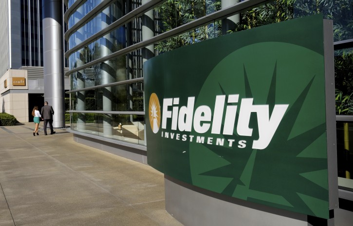 FILE - This June 16, 2016, file photo shows a sign outside of a Fidelity Investments office in the Century City section of Los Angeles. At Fidelity’s retail brokerage customers continued to put in more buy orders than sells after the S&P 500 began falling from its peak set on Jan. 26, 2018. “Millennials and Gen Xers are definitely taking advantage of these prices and taking advantage of the sell-off,” said Scott Ignall, senior vice president and head of online brokerage technology at Fidelity. (AP Photo/Richard Vogel, File)
