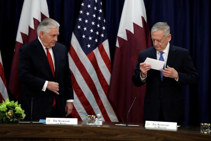 U.S. Secretary of State Rex Tillerson (L) and Defense Secretary Jim Mattis take seats before the opening session of the inaugural U.S.-Qatar Strategic Dialogue at the State Department in Washington, U.S., January 30, 2018. REUTERS/Yuri Gripas