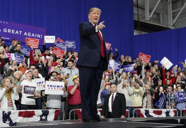 U.S. President Donald Trump points at supporters after speaking in support of Republican congressional candidate Rick Sacconne during a Make America Great Again rally in Moon Township, Pennsylvania, U.S., March 10, 2018. REUTERS/Joshua Roberts